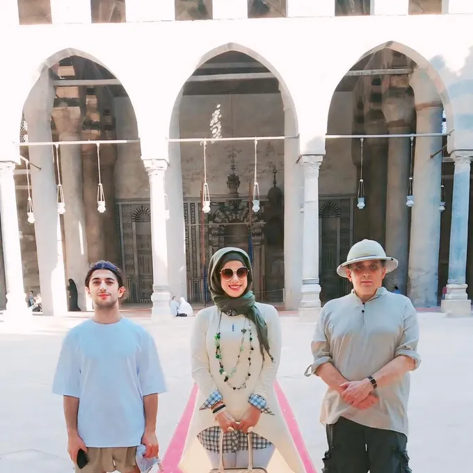 Guests in the marble courtyard of a historic Cairo mosque
