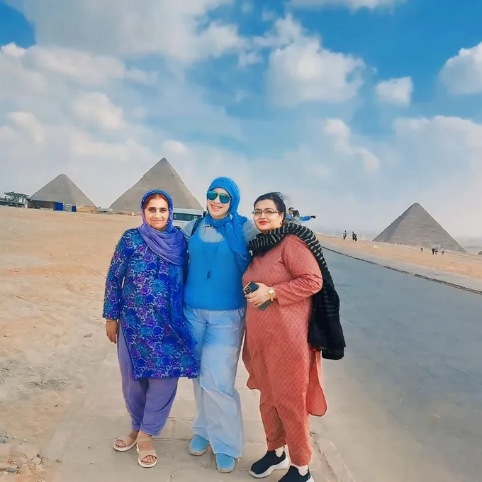 Guests at the Giza panorama viewpoint with the pyramids behind them