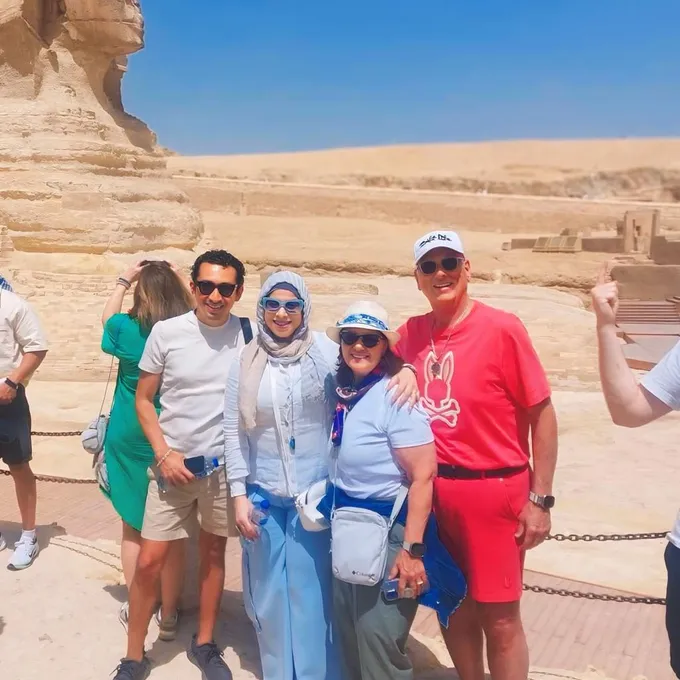 Guests laughing together beside the Great Sphinx
