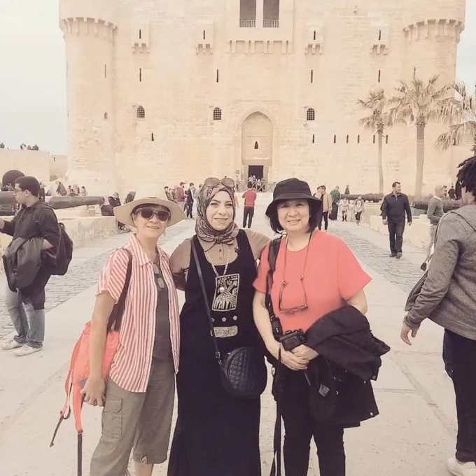 Guests at the gateway of a historic Cairo landmark