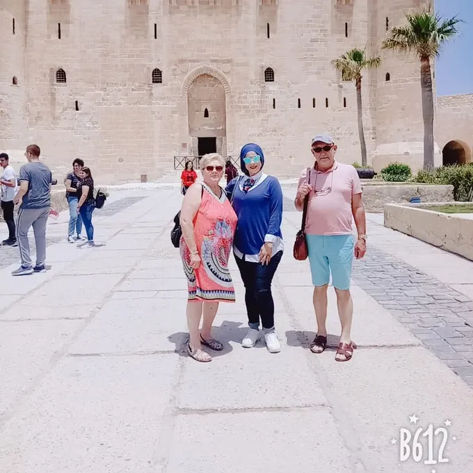A large group of guests at a historic Egyptian mosque