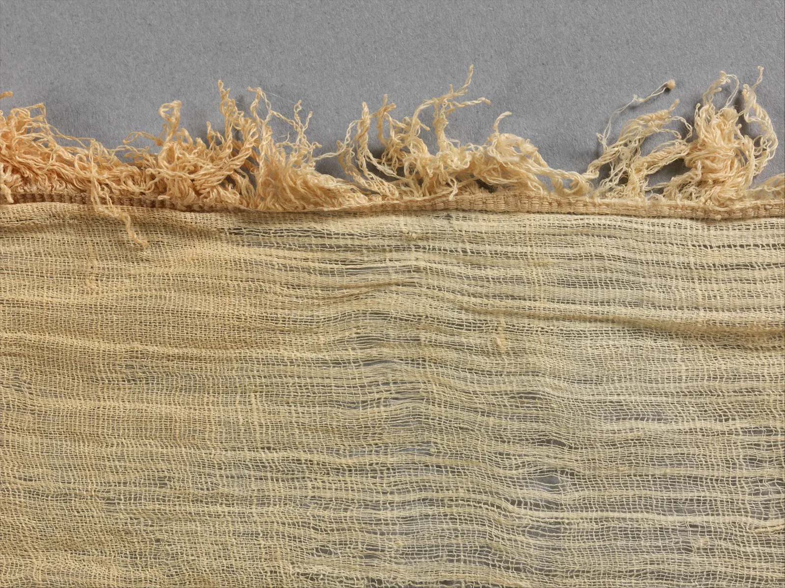 The fringe and sheer weave of an ancient Egyptian linen sheet, about 1473–1458 BC