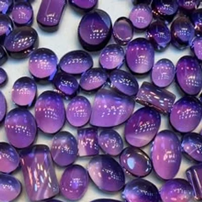 Polished amethyst cabochons